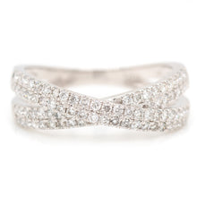 This x cross white gold band features pave set diamonds totaling .5...