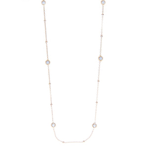 This 20 inch necklace features 7 bezel set diamonds alternated by g...