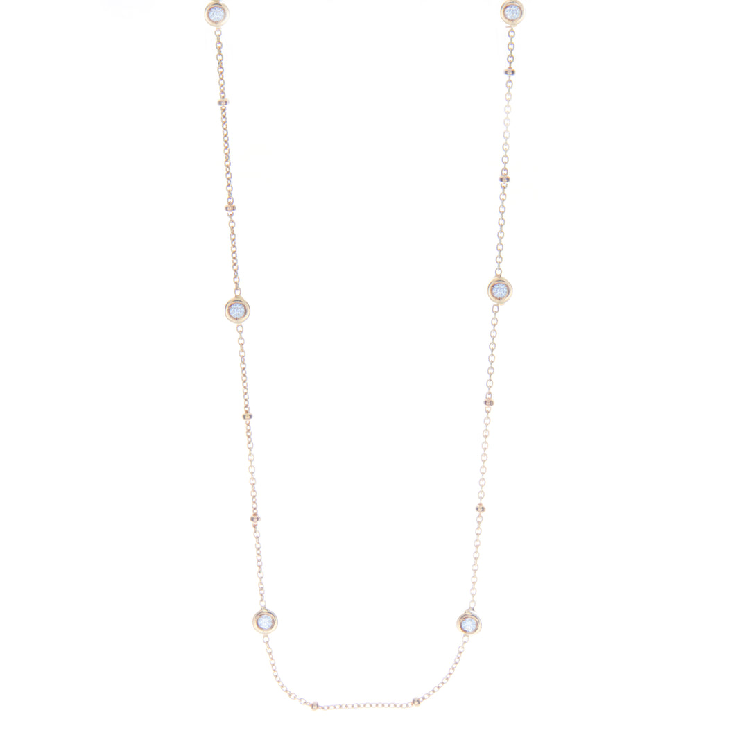This 20 inch necklace features 7 bezel set diamonds alternated by g...