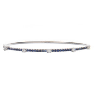 this bangle features sapphires totaling .57ct and diamonds totaling...