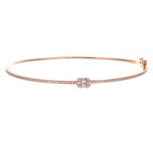 This classic bangle features 8 baguette cut diamonds totaling .08ct...