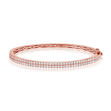 This bangle features pave set round brilliant cut diamonds that tot...