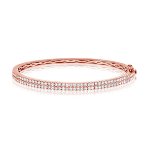 This bangle features pave set round brilliant cut diamonds that tot...