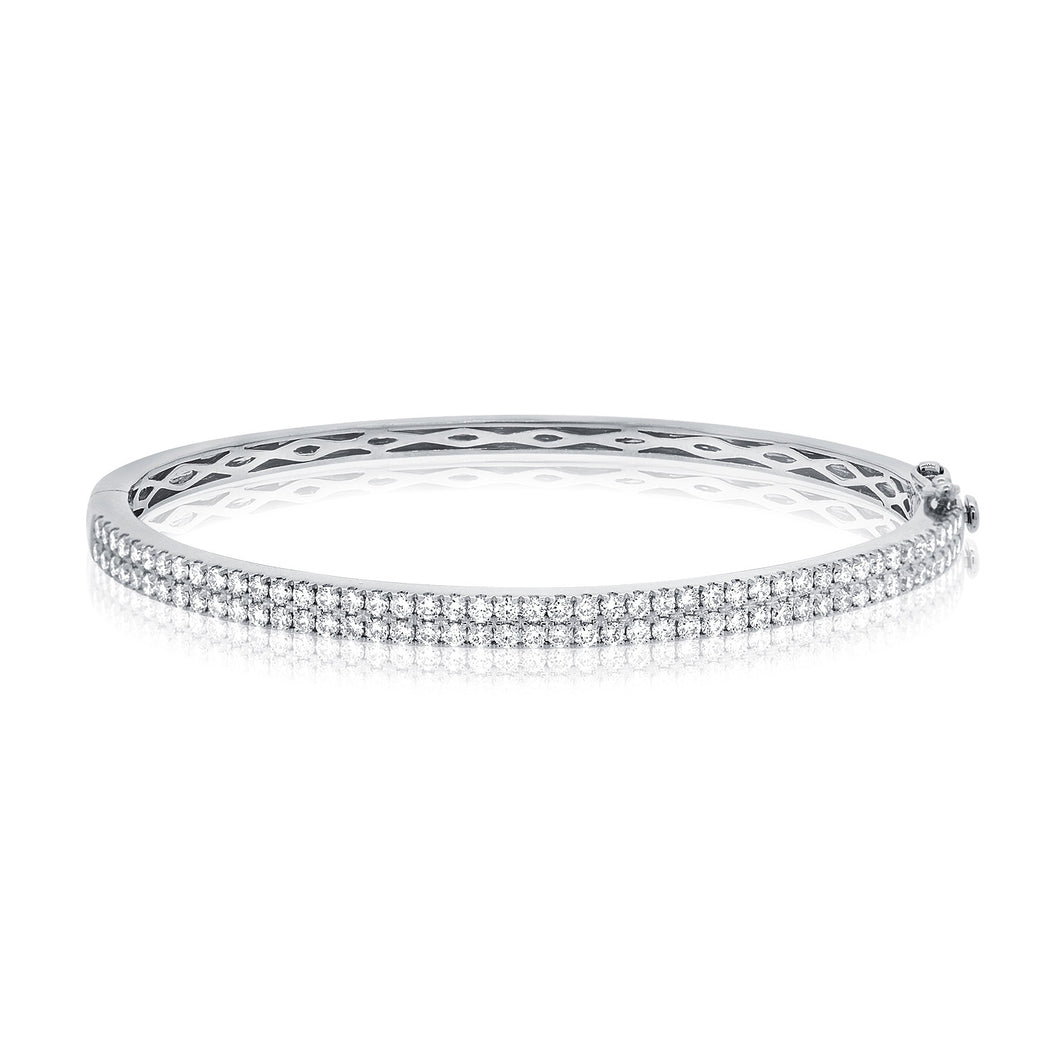 This bangle features pave set round brilliant cut diamonds that tot...