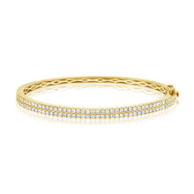 This bangle features pave set round brilliant cut diamonds that tot...