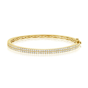 This bangle features pave set round brilliant cut diamonds that tot...