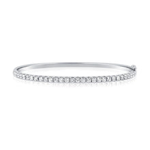 This bangle features pave set round brilliant cut diamonds that tot...