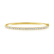 This bangle features pave set round brilliant cut diamonds that tot...
