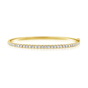This bangle features pave set round brilliant cut diamonds that tot...