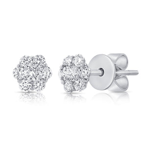 These earrings features round brilliant cut diamonds that total .55...