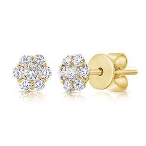 These earrings features round brilliant cut diamonds that total .55...