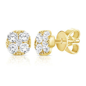These earrings features round brilliant cut diamonds that total .97...