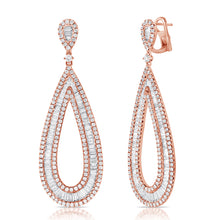 These earrings feature baguette and round brilliant cut diamonds th...