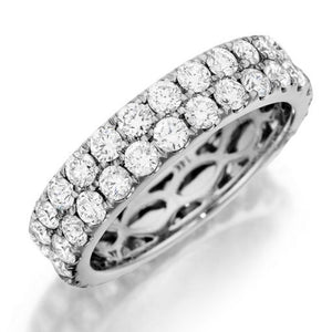 This stylish band by Henri Daussi features two rows of round brilli...