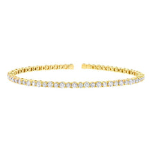 This cuff bracelet features round brilliant cut diamonds that total...