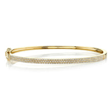 This bangle features pave set round brilliant cut diamonds that tot...