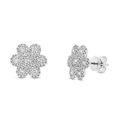 These earrings feature round brilliant cut diamonds that total .95cts.