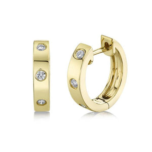 14k yellow gold huggy hoops with diamonds totaling .11ct
