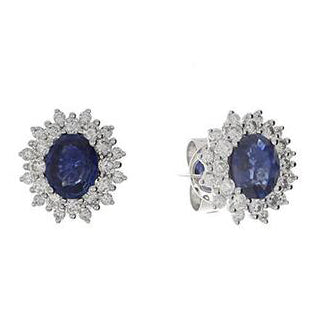 These earrings feature round brilliant cut diamonds that total .61c...