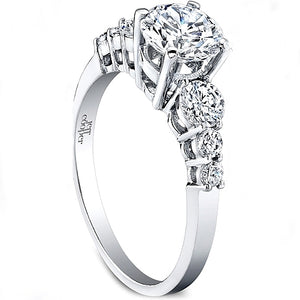 This diamond engagement ring features three graduated round brillia...