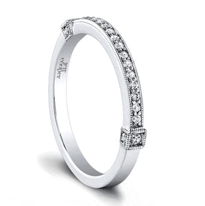 This diamond wedding band by Jeff Cooper features round reliant cut...