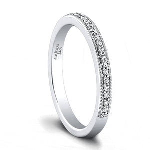 This diamond wedding band by Jeff Cooper features pave set round br...
