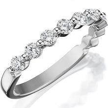 This classic style by Henri Daussi features a single row of round b...