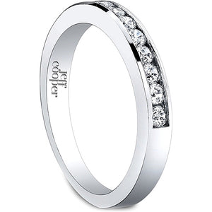 This Jeff Cooper wedding band is channel set with round brilliant c...