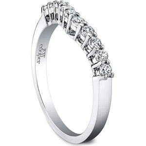 This fitted diamond wedding band by Jeff Cooper features round bril...