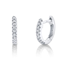 These diamond huggy earrings feature pave set round brilliant cut d...