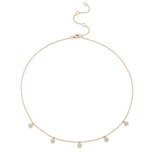 This necklace features round discs that total .22cts.
