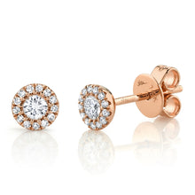 These diamond stud earrings feature round brilliant cut diamonds th...