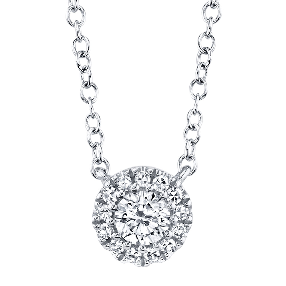 This necklace features round brilliant diamonds that total .14cts.