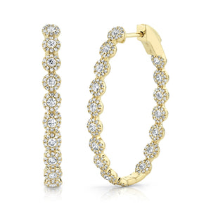 These hoop earrings feature round brilliant cut diamonds that total...