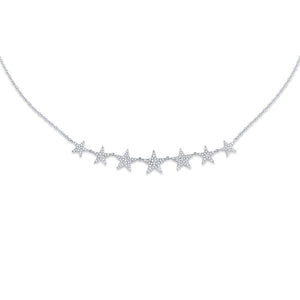 This gold star necklace features pave set round brilliant cut diamo...
