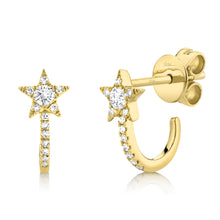 These star earrings features round brilliant cut diamonds that tota...