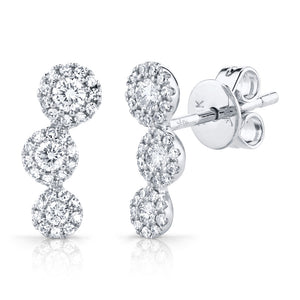 These stud earrings feature round brilliant cut diamonds that total...