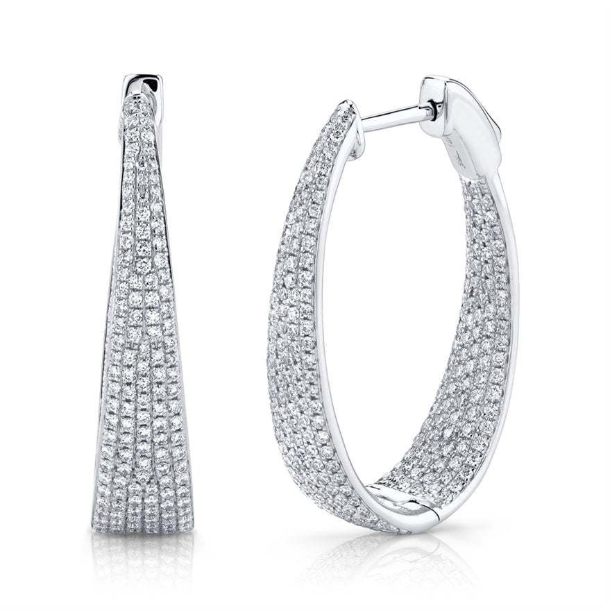 These diamond earrings feature pave set round brilliant cut diamond...