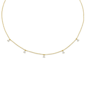 This necklace features round brilliant cut diamond drops that total...