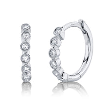 These diamond hoops feature round brilliant cut diamonds that total...