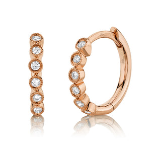 These diamond hoops feature round brilliant cut diamonds that total...