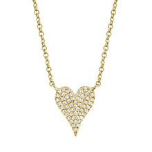 This heart necklace features round brilliant cut diamonds that tota...