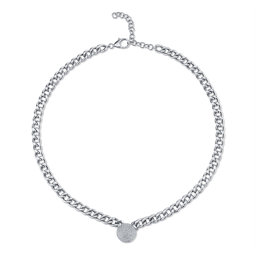 This diamond necklace features cuban links with a pave heart that t...