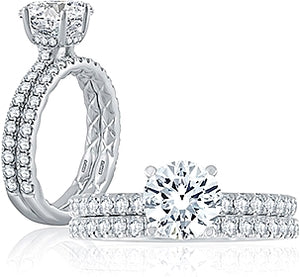 This wedding band features diamonds set in a French pave setting an...