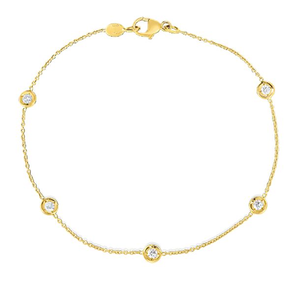 This 18k yellow gold bracelet features bezel set round brilliant cu...