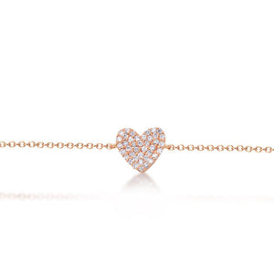 This diamond heart bracelet features .16cts of pave set round brill...