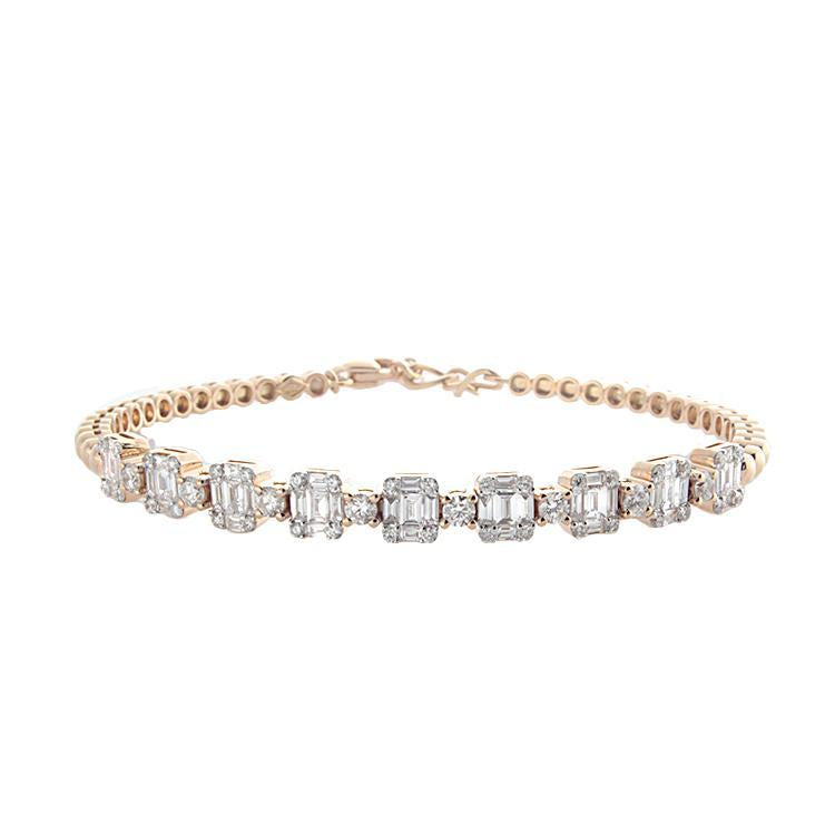 This diamond bracelet features baguette and round brilliant cut dia...