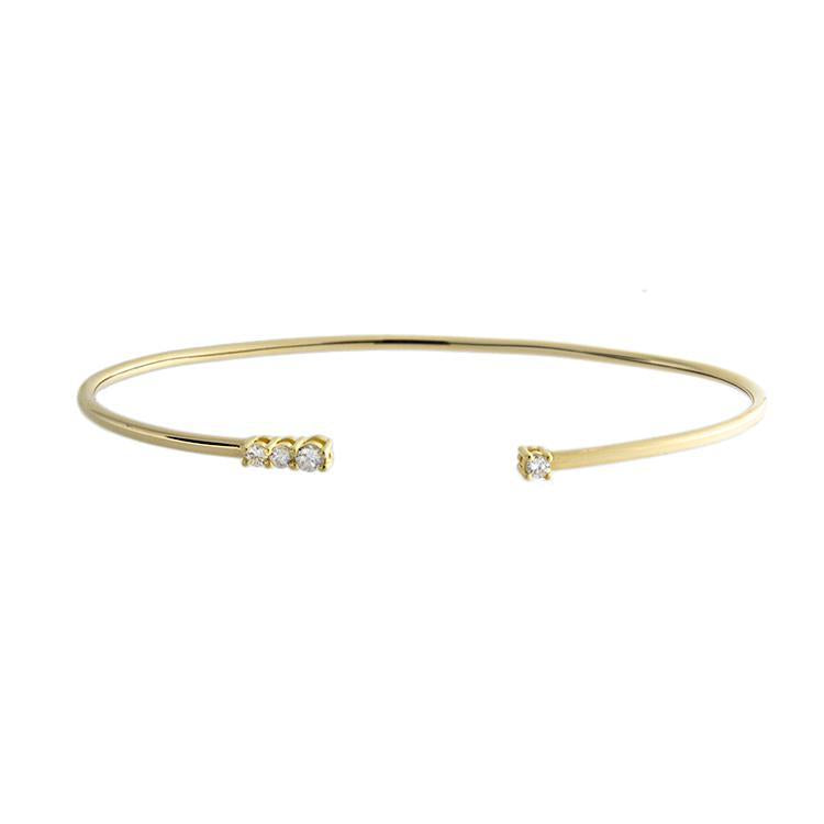 This bracelet features four round brilliant cut diamonds that total...