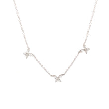 This minimalist white gold necklace features diamonds in a butterfl...