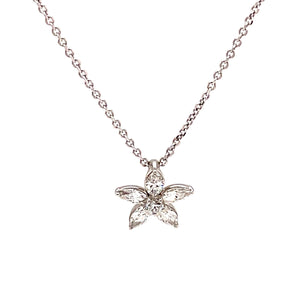 This flower shaped pendant features marquise diamonds and round bri...